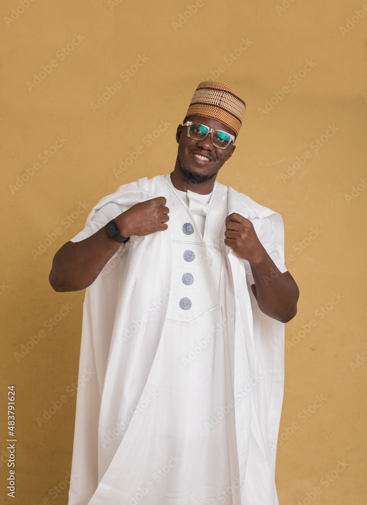 A Traditionally Dressed Northern Business Man Smiling A Traditionally Dressed Northern Business Man Smiling