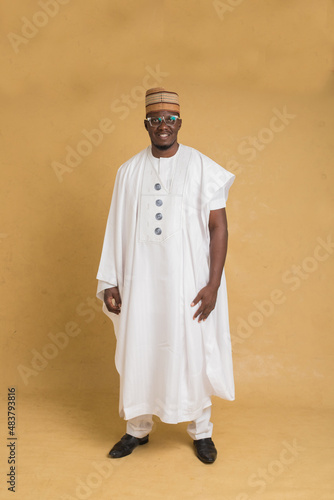 A Traditionally Dressed Northern Business Man Standing