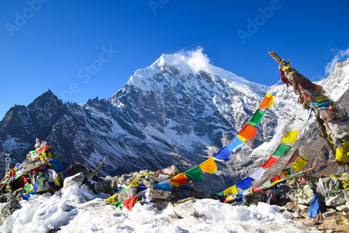 Kyanjin Ri viewpoint in the Himalaya mountains in Nepal with prayer flags. Tamang Heritage Trail and Langtang trek day 8 to Kyanjin Ri