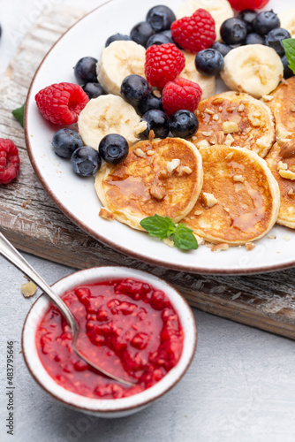 Keto pancakes made of diet flour or almond flour, served with berries.