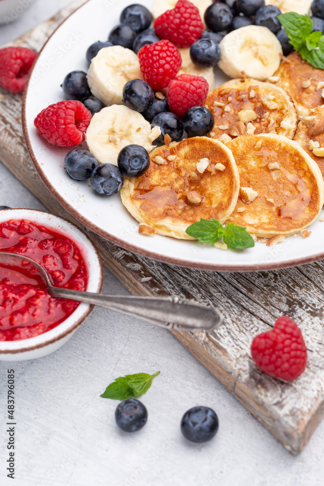 Keto pancakes made of diet flour or almond flour, served with berries. Keto pancakes made of diet flour or almond flour, served with berries.