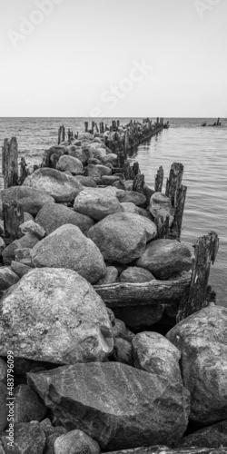 an old pier made of stones and wood
