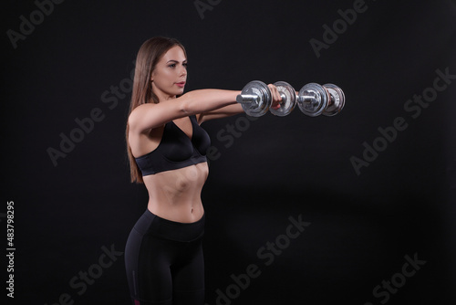 Athletic young woman doing workout with weights © zhagunov_a