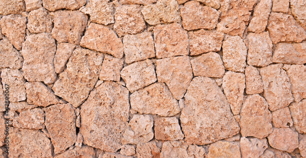 Masonry wall of stones with irregular pattern texture. Masonry wall of stones with irregular pattern texture.