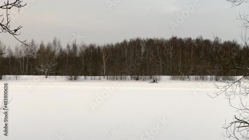 Wallpaper Mural Snowmobiles drive fast on the surface of a frozen lake in winter. Torontodigital.ca