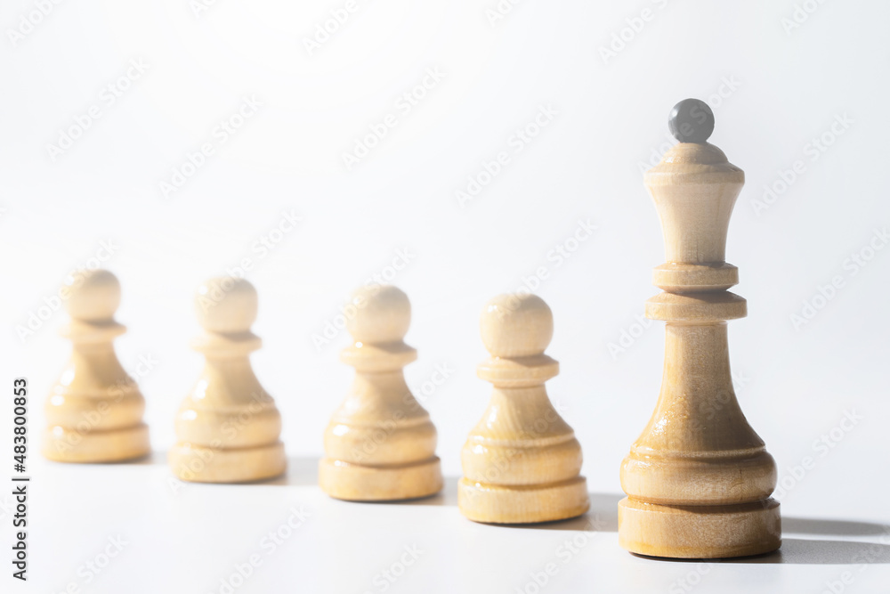 Row of chessmen with queen in the lead. Row of chessmen with queen in the lead.