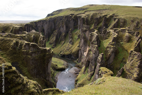 Green Grassy mountain Landscape in the highlands. Travel and nature on a beautiful cold day