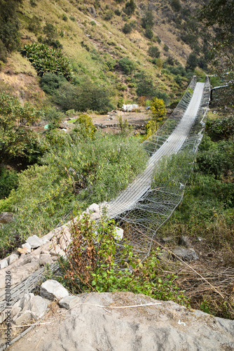 Broken suspension bridge in the Himalaya mountains in Nepal. Tamang Heritage Trail and Langtang trek day 11 from Rimche to Syabrubesi photo