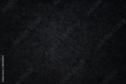 Photography Texture of black wood veneer with vignette. Macro photo.
