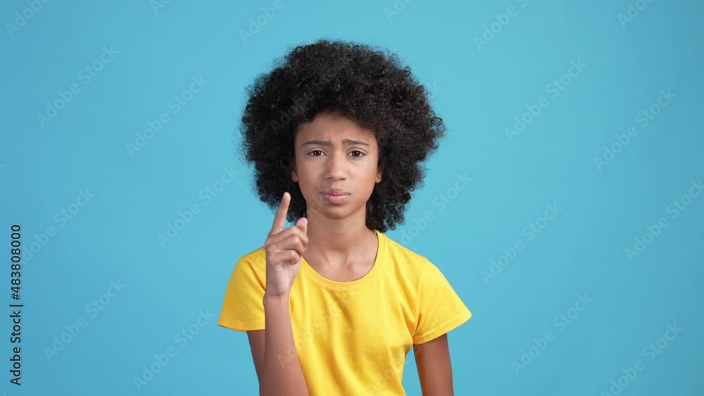 Kid girl not like music ask be silent isolated blue color background Kid girl not like music ask be silent isolated blue color background