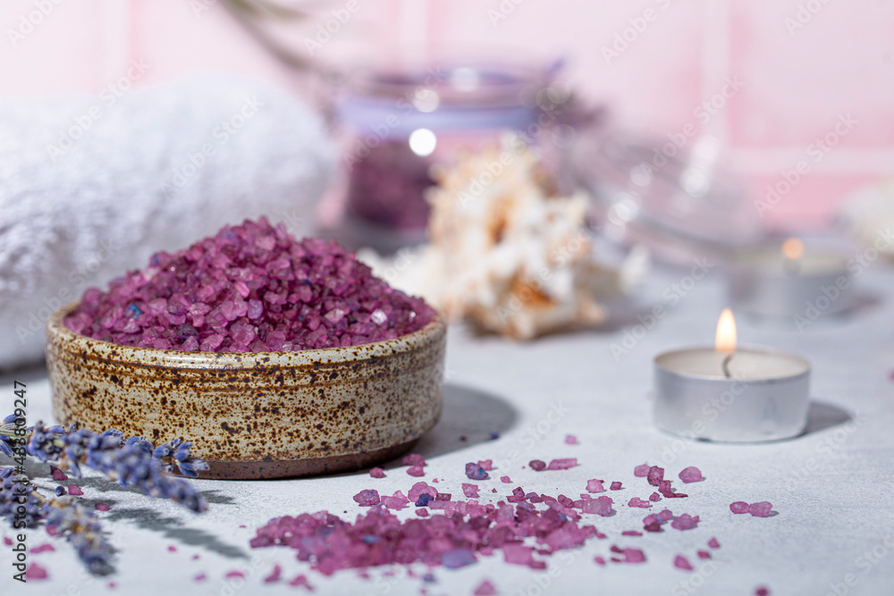 Purple bath salt with lavender, towel and candles Purple bath salt with lavender, towel and candles