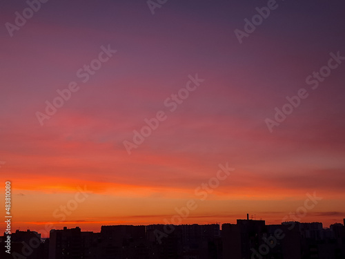 Sunset background with wonderful red golden  yellow sky  Amazing purple and orange sky in evening during the sun going down above city.Dramatic sunset sky with clouds