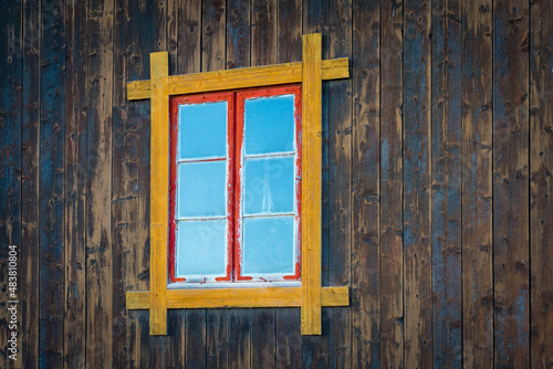 old routed vernacular window of a barn wall photo