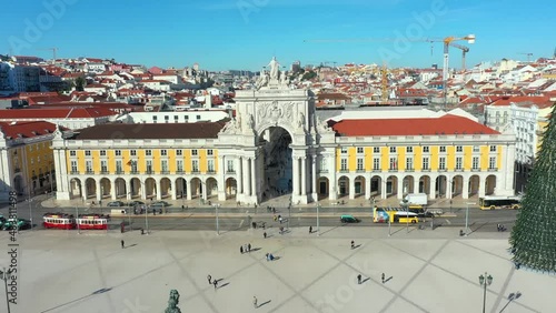 Aerial drone view of the Augusta Street Arch from Commerce Square in Lisbon, Portugal. Sunny day with blue sky. Joseph I portuguese king statue. (ID: 483811498)