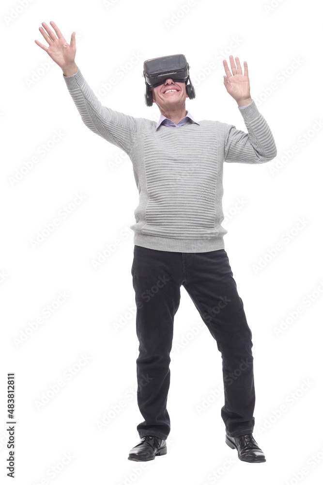 in full growth. smiling man in virtual reality glasses. in full growth. smiling man in virtual reality glasses.