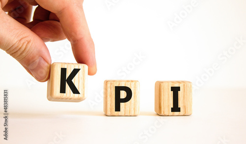 KPI, key performance indicator symbol. Concept word KPI, key performance indicator on wooden cubes on beautiful white background, copy space. Business, KPI, key performance indicator concept.
