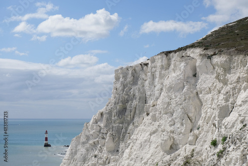 Detailed view of Seven Sisters' white chalk cliffs and Beachy Head Lighthouse in Eastbourne, East Sussex, England, UK