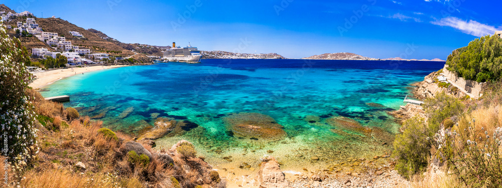 Best cruise destination in Mediterranean coast. Greece, Cyclades, Mykonos island. Cruise ship near the beach Agios Stefanos