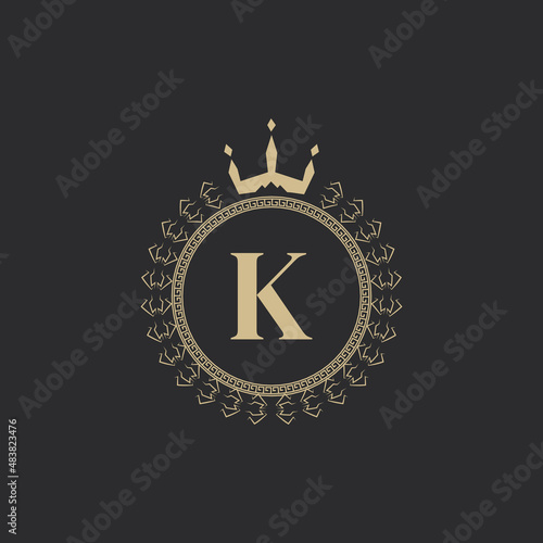 Initial Letter K Heraldic Royal Frame with Crown and Laurel Wreath. Simple Classic Emblem. Round Composition. Graphics Style. Art Elements for Logo Design Vector Illustration
