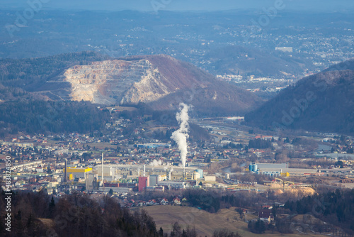 Aerial view of Gratkorn, Gratwein and Judendorf near with a huge paper factory and a stone pit in the background photo