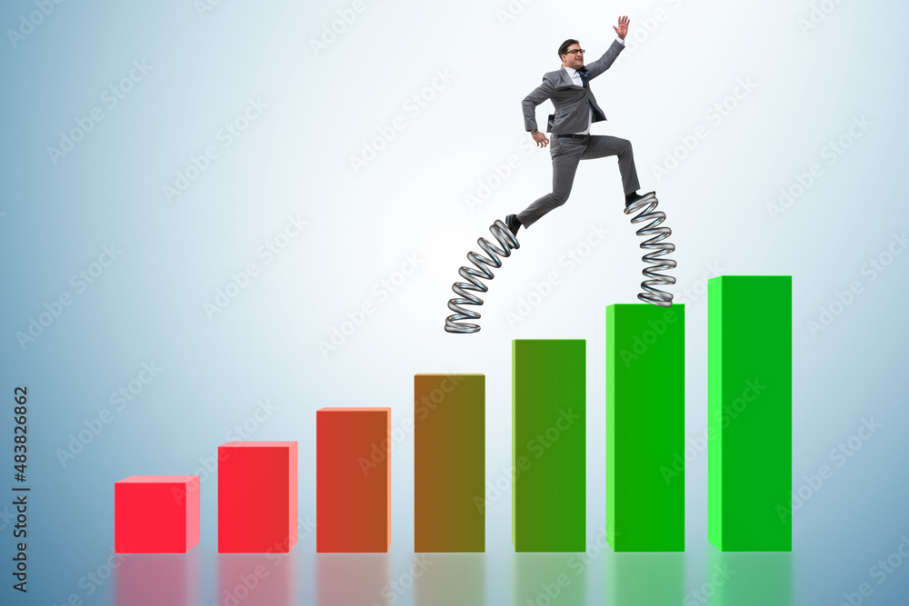 Businessman jumping high on springs Businessman jumping high on springs