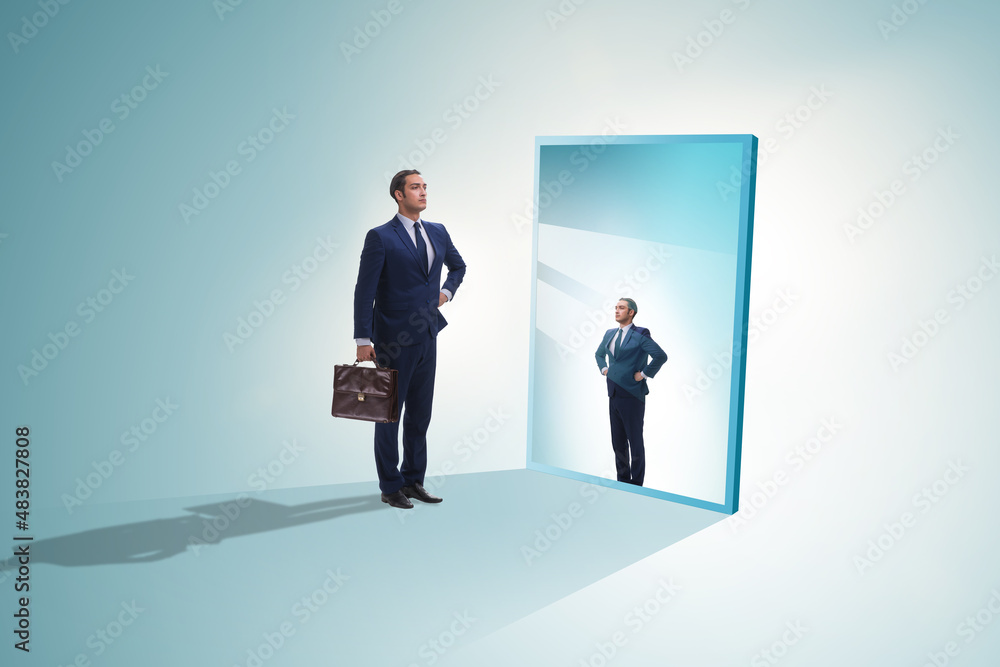 Young businessman in alter ego concept Young businessman in alter ego concept