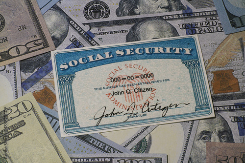 Fake Social security card on prop US currency - Concept of Social Security Benefits photo