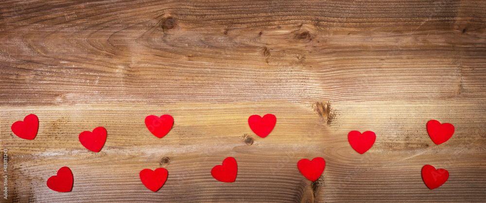 Fabric hearts on a wooden background with copy space Fabric hearts on a wooden background with copy space