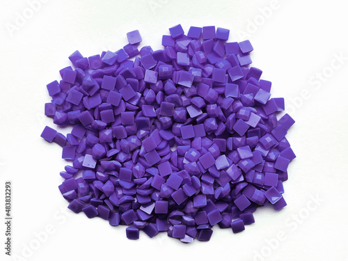 Set of violet diamonds for diamond embroidery isolated on white background. Hobbies and DIY, materials for creating diamond embroidery