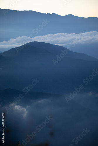 Blue beautiful mountains Ands in Colombia Latin America with clouds and fogs in the early morning, landscape © Evgenia