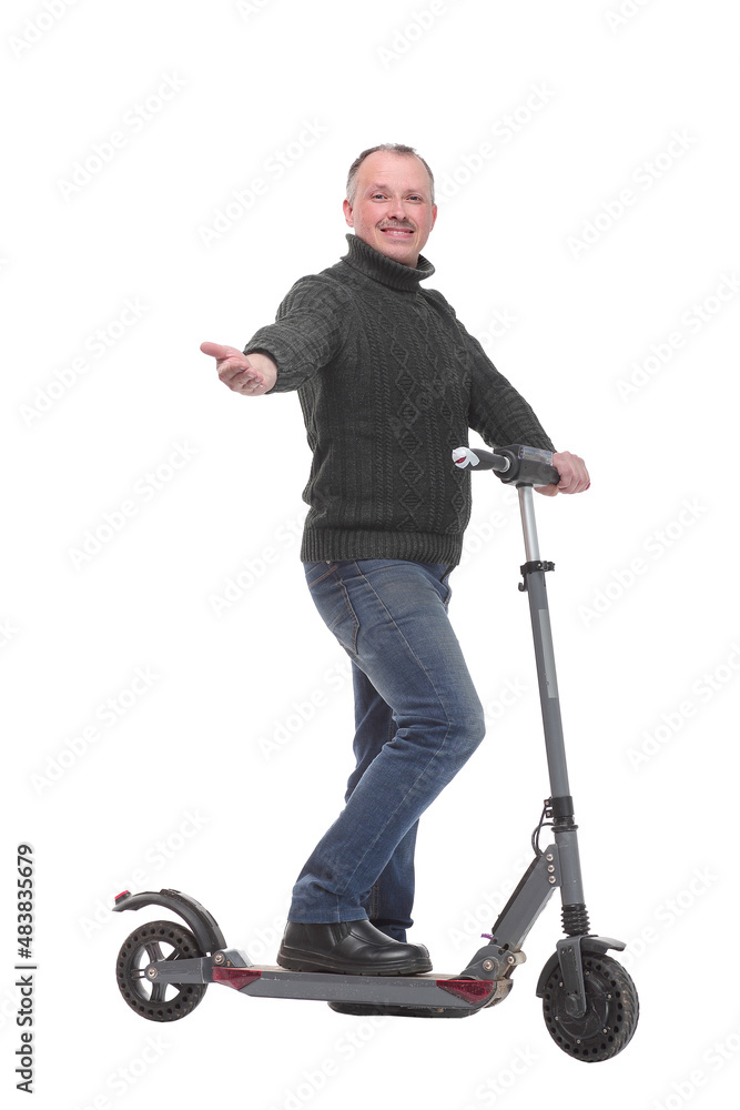 Side view of young modern man using and driving electric isolated over white background Side view of young modern man using and driving electric isolated over white background