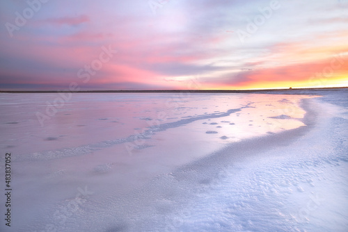Soft Pink Morning Light on a Frozen Colorado Lake © rondakimbrow