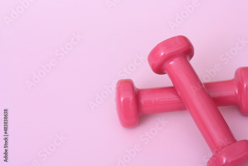 Dumbbells isolated on pink