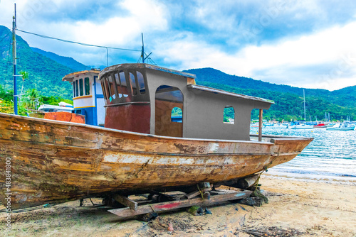 Old boats ships for restoration Abraao beach Ilha Grande Brazil.