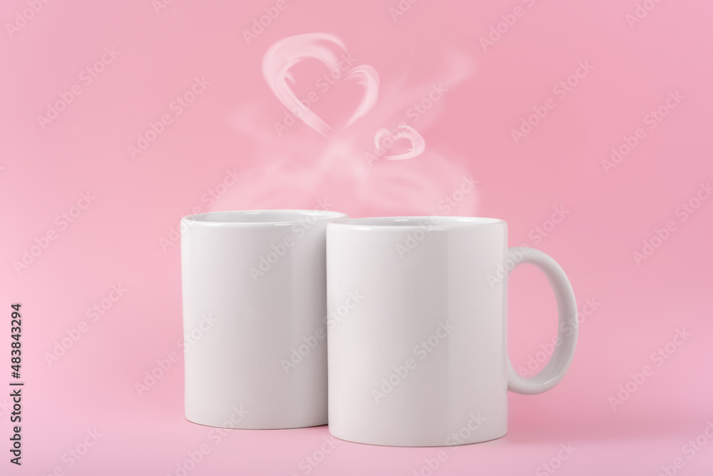 Mockup white coffe two cups or mug on a pink background with copy space. Blank template for your design, branding, business. Real photo. Hot drink steam in the form of hearts Mockup white coffe two cups or mug on a pink background with copy space. Blank template for your design, branding, business. Real photo. Hot drink steam in the form of hearts