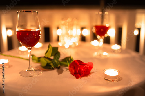 romantic dinner setting with rose and candle light