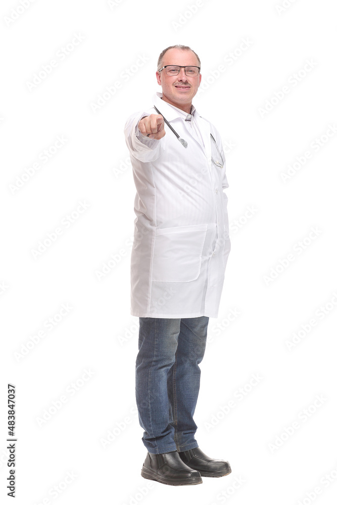 Cheerful mature doctor looking at camera and pointing away Cheerful mature doctor looking at camera and pointing away