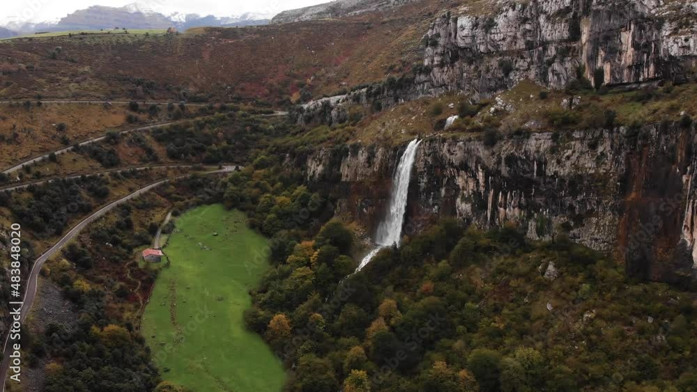 Giant waterfall inside a forest in autumn Giant waterfall inside a forest in autumn