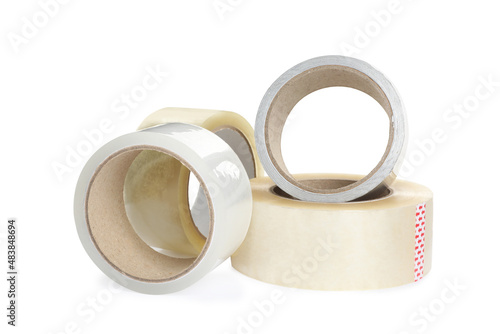 Many different rolls of adhesive tape on white background