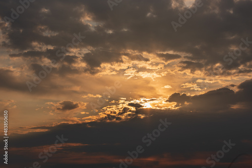 Dramatic Sunset Sky with Dark Clouds and Golden Rays