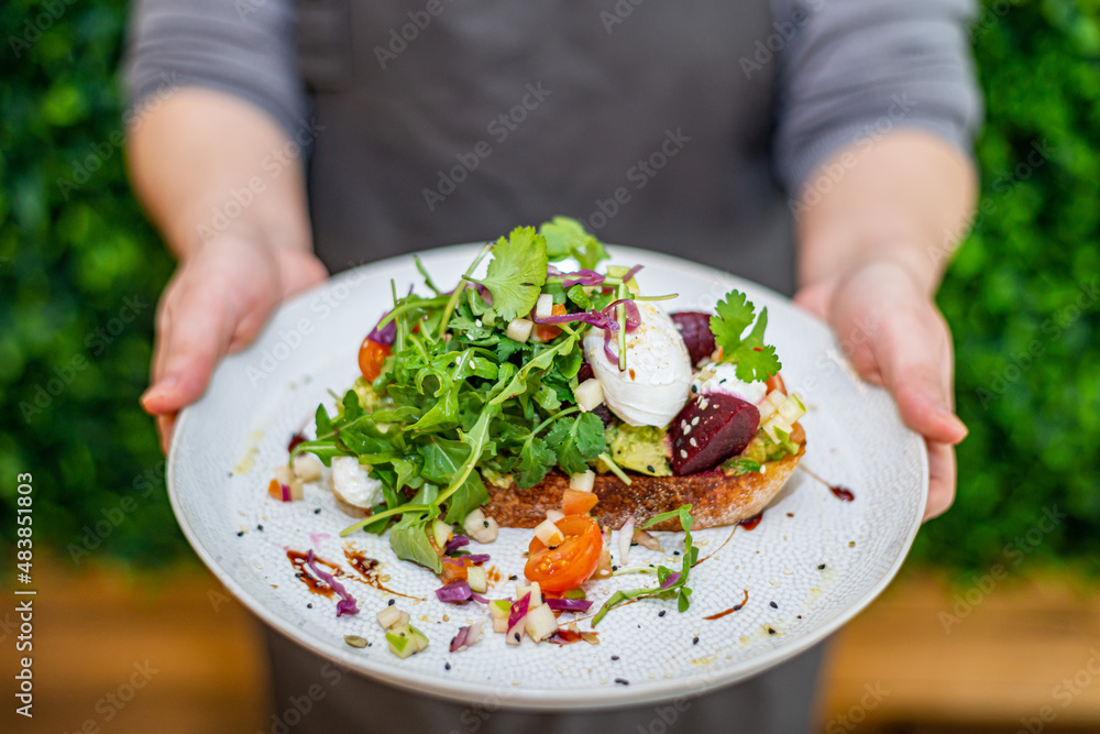 person holding a salad