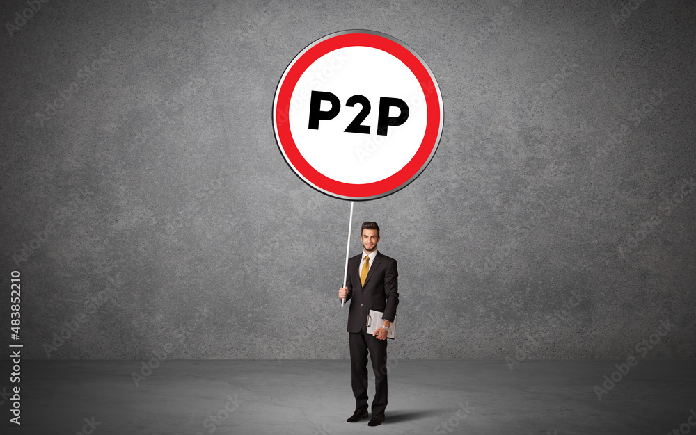 Obraz premium Young business person holdig traffic sign