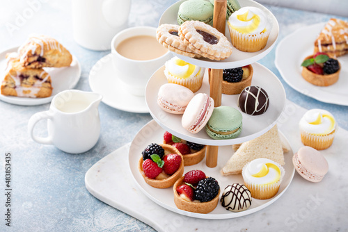 Spring or summer dessert table, three tiered tray with desserts