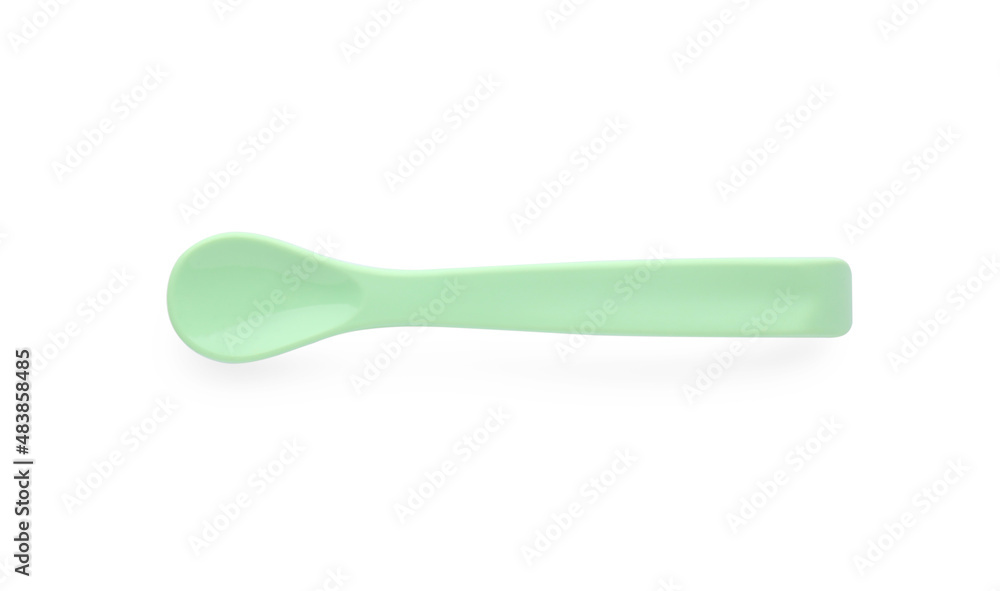 Plastic spoon isolated on white, top view. Serving baby food Plastic spoon isolated on white, top view. Serving baby food