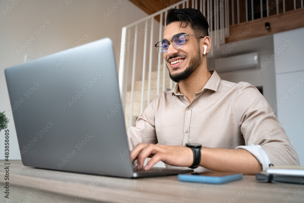 Man freelancer work online on laptop from home office using internet technology Man freelancer work online on laptop from home office using internet technology