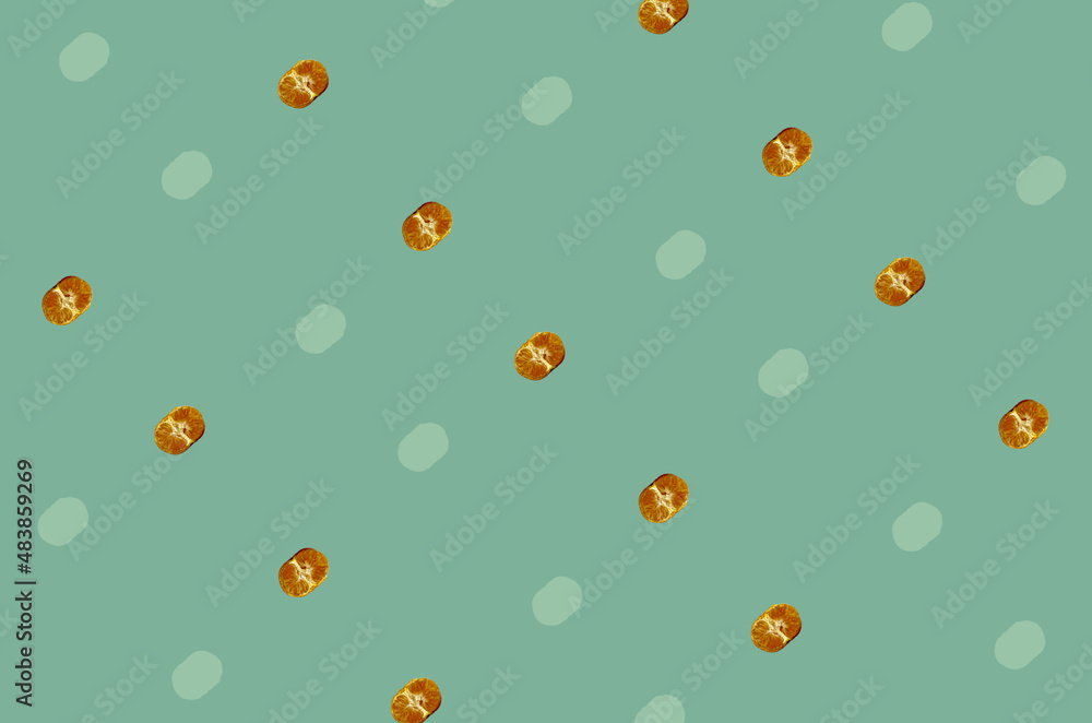 Colorful fruit pattern of fresh tangerines on green background. Mandarine. Top view. Flat lay. Pop art design Colorful fruit pattern of fresh tangerines on green background. Mandarine. Top view. Flat lay. Pop art design