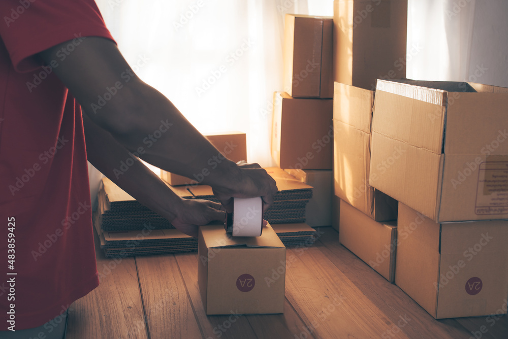 Man holds boxes in hands, moving to new house. Diverse of paper containers for takeaway food. Home business online delivery. Fast and free Delivery transport. Online shopping and Express delivery. Man holds boxes in hands, moving to new house. Diverse of paper containers for takeaway food. Home business online delivery. Fast and free Delivery transport. Online shopping and Express delivery.