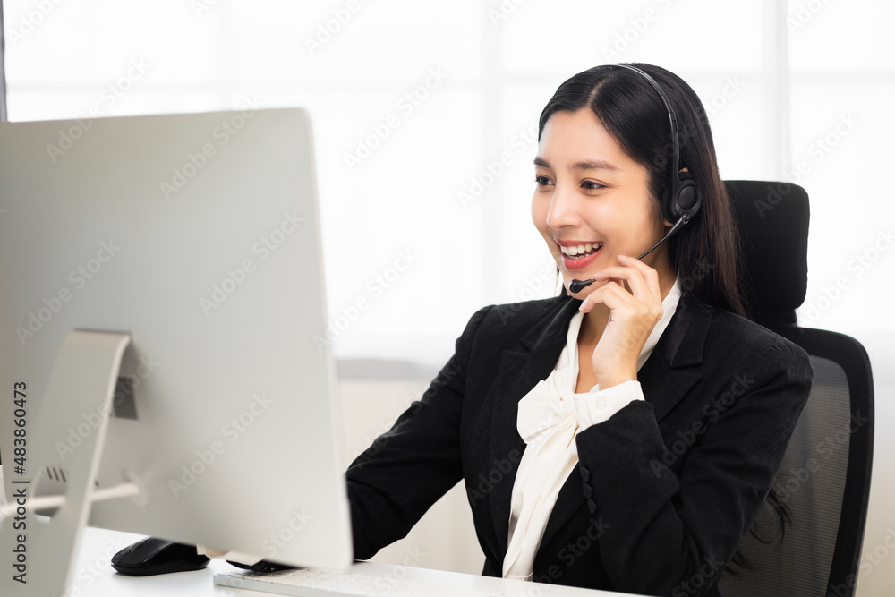 Call centre female operator. Smiling asian business woman receptionist wearing headphone video conference calling talk by webcam in online chat customer support service. Call centre female operator. Smiling asian business woman receptionist wearing headphone video conference calling talk by webcam in online chat customer support service.