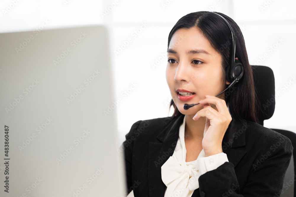 Call centre female operator. Smiling asian business woman receptionist wearing headphone video conference calling talk by webcam in online chat customer support service. Call centre female operator. Smiling asian business woman receptionist wearing headphone video conference calling talk by webcam in online chat customer support service.
