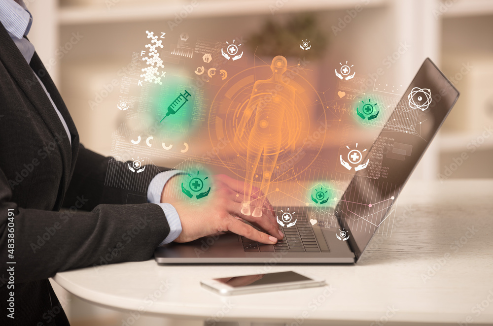 Doctor working on laptop with healthcare concept Doctor working on laptop with healthcare concept